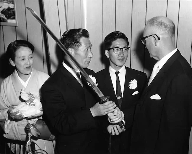 Japanese WW2 pilot Nobuo Fujita presents his family's sword to the mayor of Brookings in 1962.